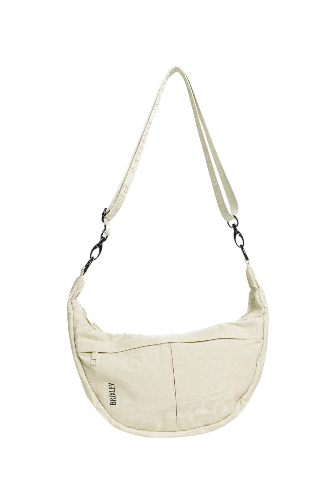 An off-white crescent-shaped shoulder bag with a matching adjustable shoulder strap, featuring a front zippered pocket and a small black 'BRIXLEY' logo, shown against a plain white background.