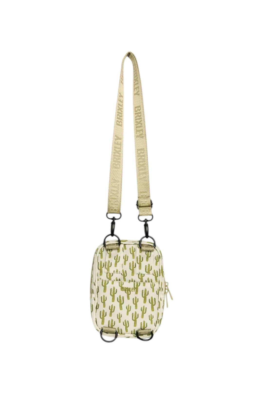 A small crossbody bag with a green cactus pattern on a cream background, featuring a matching adjustable shoulder strap with 'BRIXLEY' printed repeatedly, shown against a plain white background.
