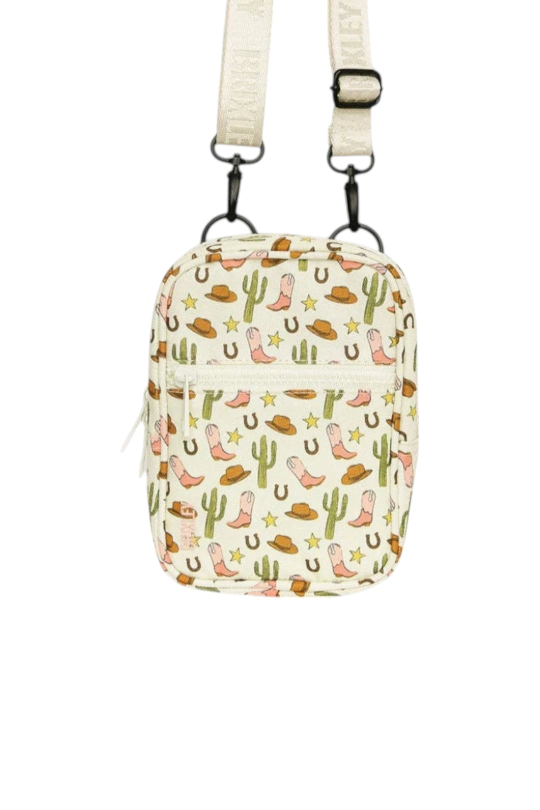 A small crossbody bag with a western-themed print featuring cowboy boots, cacti, horseshoes, and stars on an off-white background. The bag has a cream-colored shoulder strap with black metal hardware.