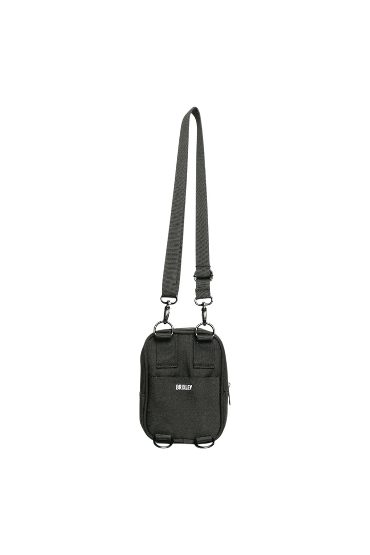 A black utility pouch bag with an adjustable shoulder strap and metal hardware, featuring a small white logo on the front, shown against a plain white background.