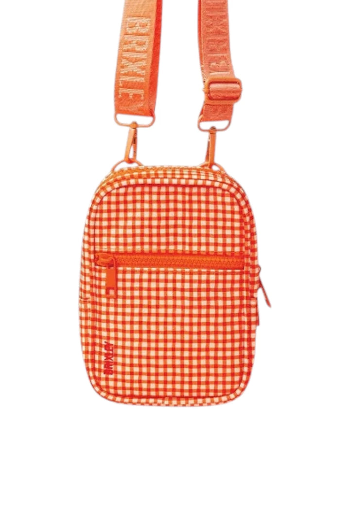An orange and white gingham check crossbody bag with a matching orange strap featuring white lettering, shown against a plain white background.