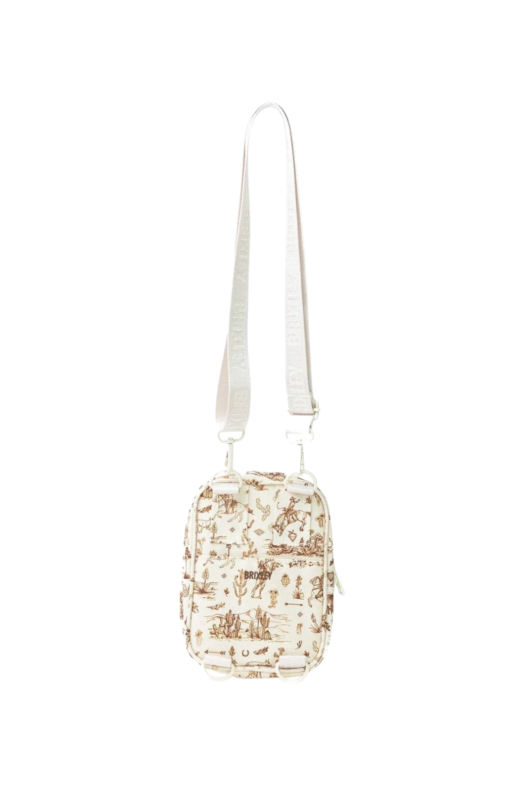 A small crossbody bag with a cream-colored fabric body featuring a brown desert scenery, complete with a matching cream-colored shoulder strap.