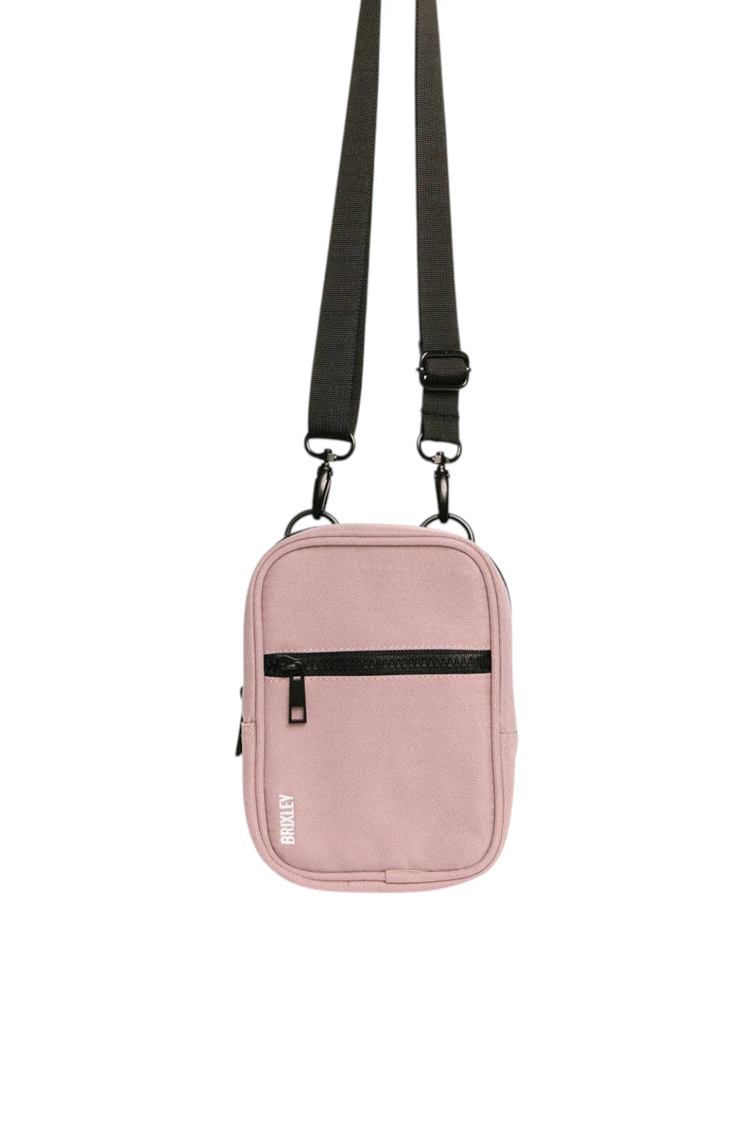 A light pink crossbody bag with a black adjustable shoulder strap, a black horizontal zippered pocket, and a small white 'BRIXLEY' logo on the lower left front, shown against a plain white background.