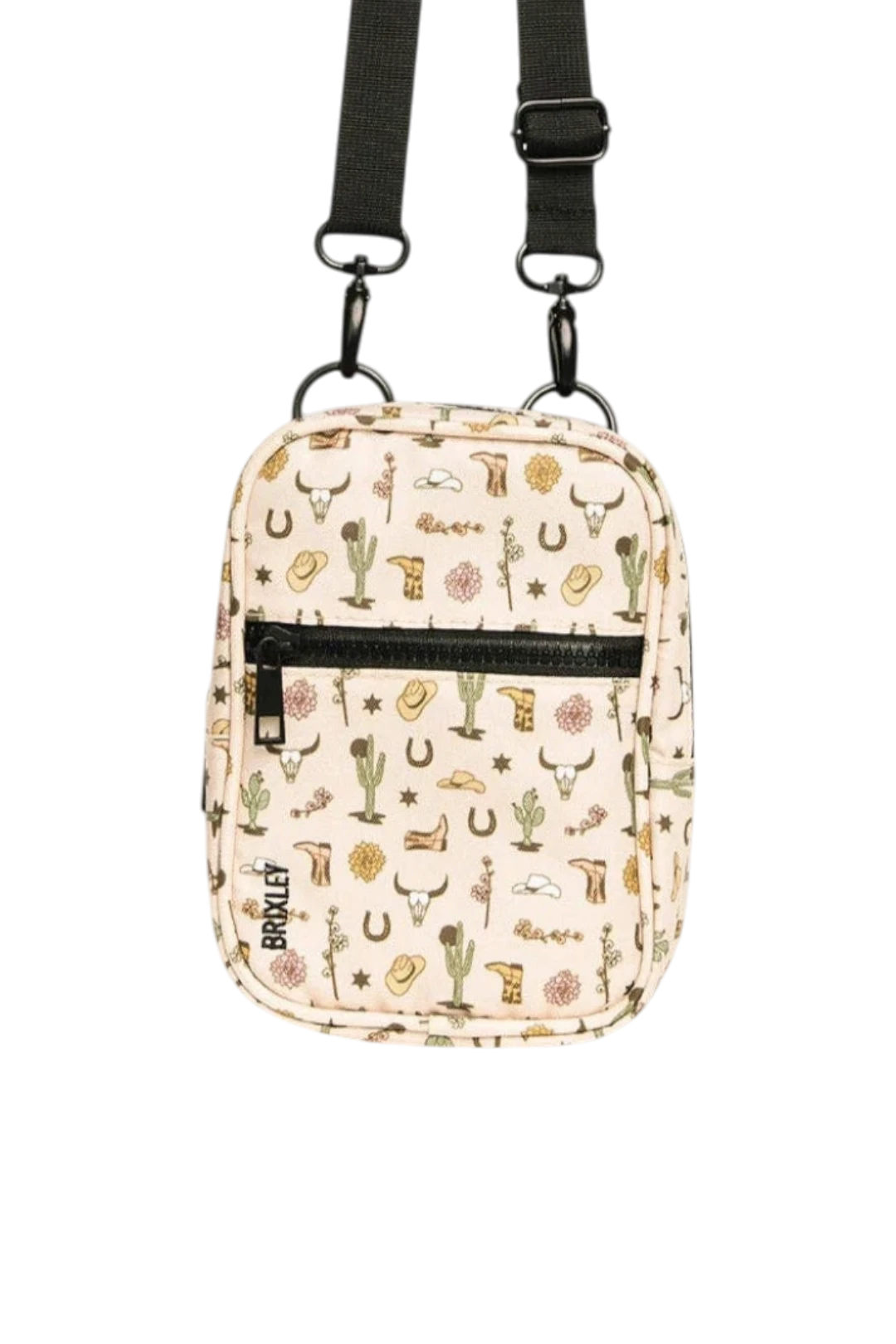 A small crossbody bag with a western-themed print on a cream background, featuring a black zipper, black strap, and western motifs like boots, horseshoes, and cacti. The brand name 'BRIXLEY' is printed vertically on the front.
