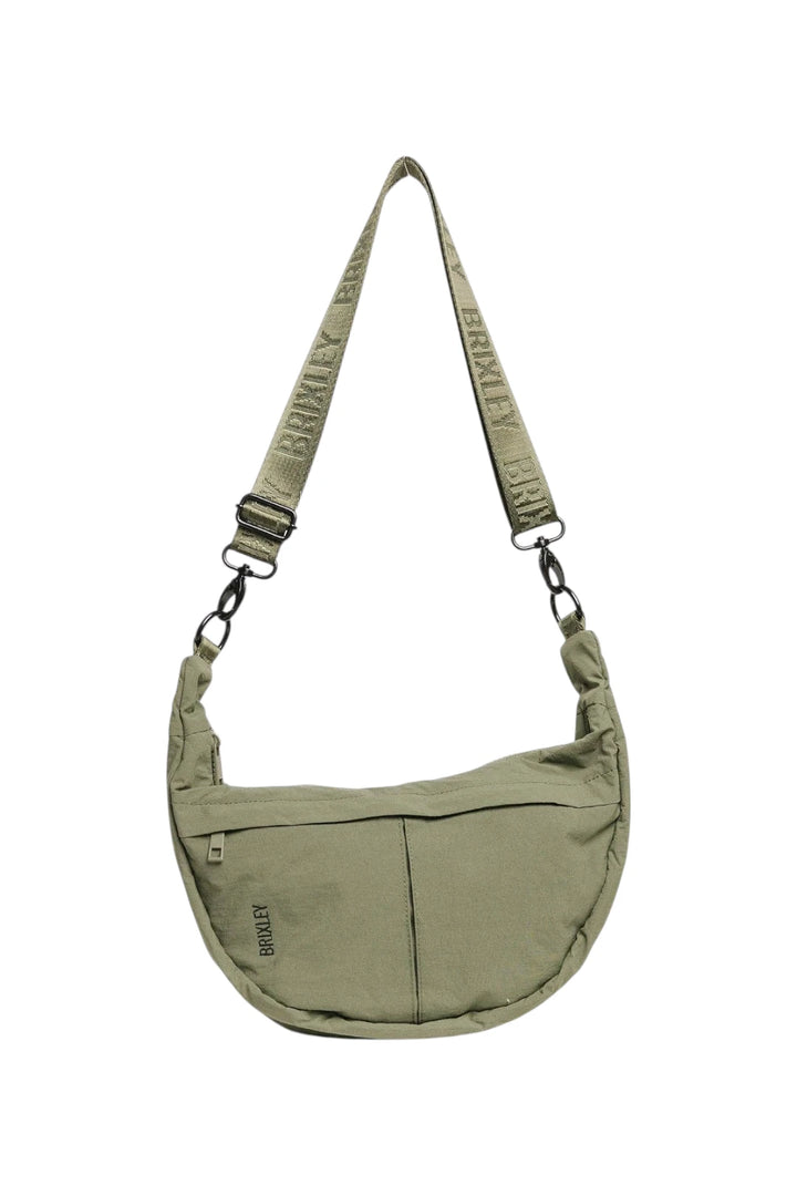 An olive green crescent-shaped shoulder bag with a matching branded webbing strap, shown against a plain white background.