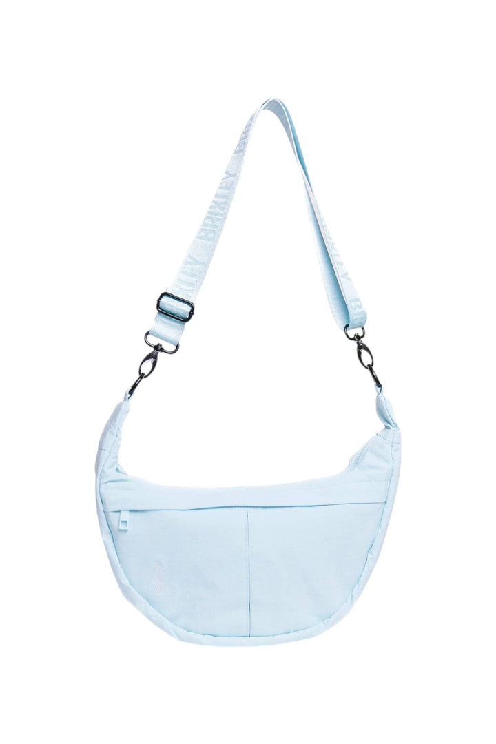A light blue crescent-shaped shoulder bag with a matching adjustable shoulder strap, shown against a plain white background.