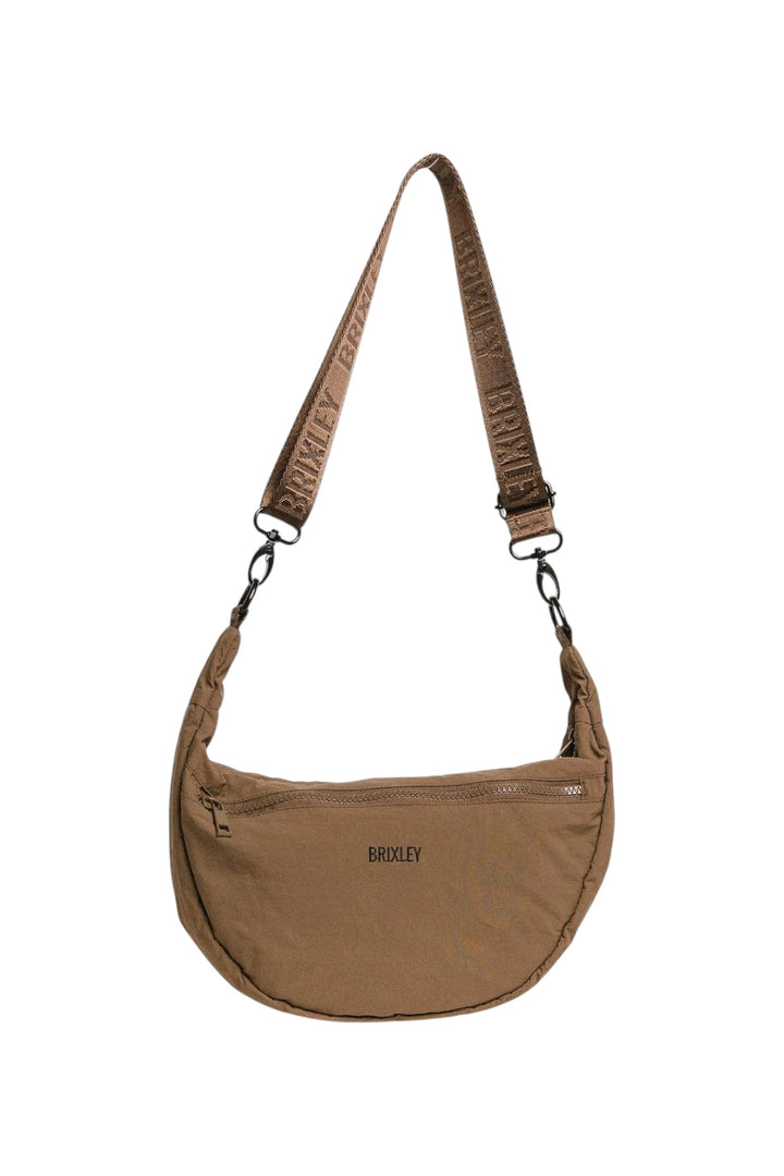 A brown crescent-shaped shoulder bag with a matching patterned strap, featuring the brand name 'BRIXLEY' printed on the front and strap, set against a plain white background.