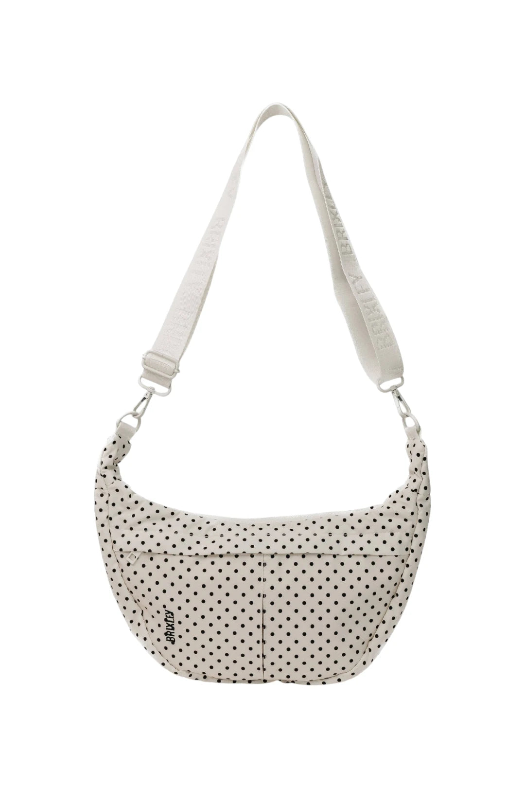 A white crescent-shaped shoulder bag with black polka dots and a matching white adjustable shoulder strap, shown against a plain white background.