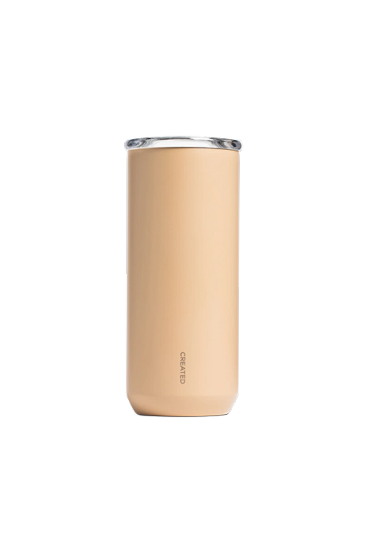A tall, slim insulated tumbler in a warm desert color with a clear rim, shown against a solid white background. The brand name 'CREATED' is printed vertically near the bottom.