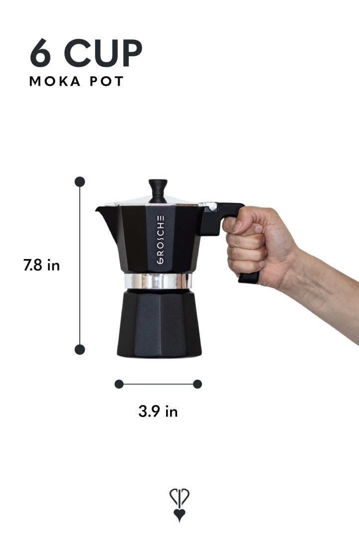 A black 6-cup moka pot with a hand gripping the handle, shown with dimension lines indicating a height of 7.8 inches and a width of 3.