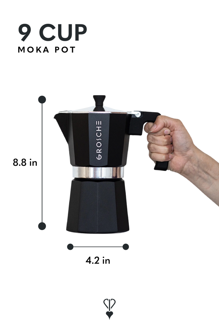 A black moka pot with a hand holding the handle to show scale, with dimension labels indicating 8.8 inches tall and 4.